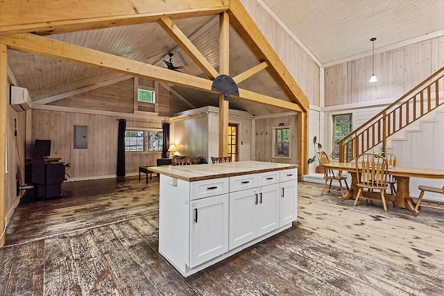 16 Trillium Ests, Rome, ME 04963 - kitchen featuring wooden counters, open floor plan, dark wood finished floors, a wall mounted AC, and wooden walls