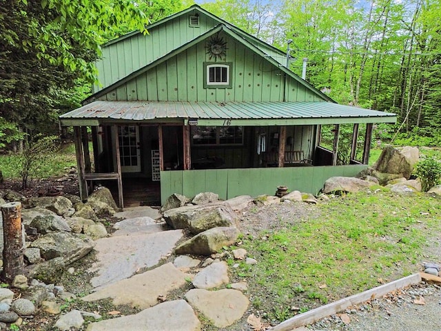 16 Trillium Ests, Rome, ME 04963 - view of front of home with board and batten siding, a porch, and metal roof