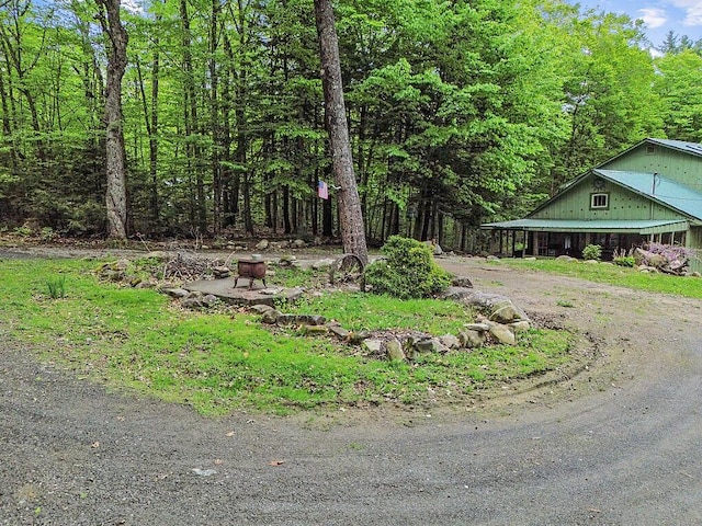 16 Trillium Ests, Rome, ME 04963 - view of yard featuring a view of trees and dirt driveway