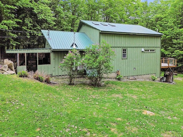 16 Trillium Ests, Rome, ME 04963 - view of property exterior with a lawn, metal roof, and board and batten siding