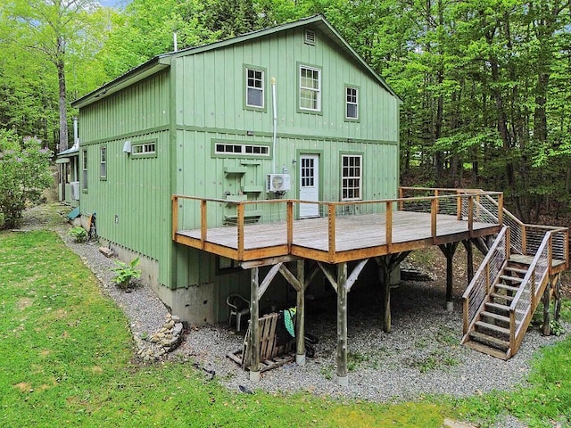 16 Trillium Ests, Rome, ME 04963 - rear view of property featuring board and batten siding, a deck, and a view of trees