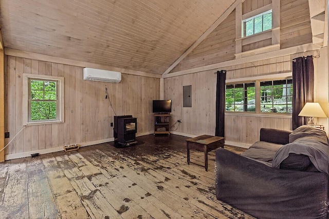 16 Trillium Ests, Rome, ME 04963 - living room with a wood stove, hardwood / wood-style flooring, a wall mounted AC, electric panel, and healthy amount of natural light