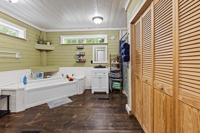 16 Trillium Ests, Rome, ME 04963 - full bath featuring a garden tub, wood ceiling, wood-type flooring, plenty of natural light, and wood walls