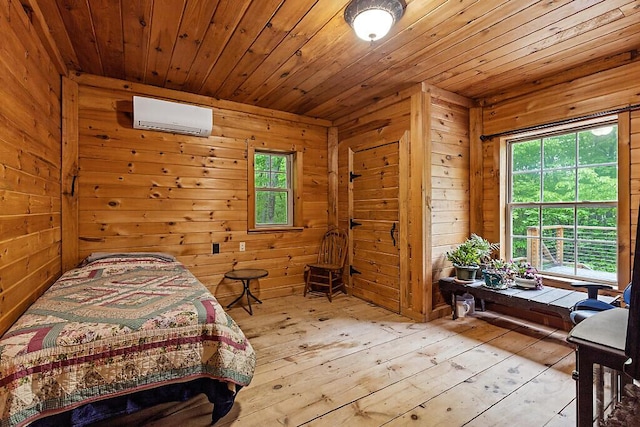 16 Trillium Ests, Rome, ME 04963 - bedroom featuring a wall mounted air conditioner, wooden walls, wood-type flooring, and wooden ceiling
