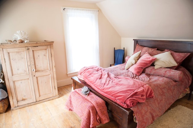 1 Forest St, Dover-Foxcroft, ME 04426 - bedroom featuring lofted ceiling, light wood-type flooring, and baseboards