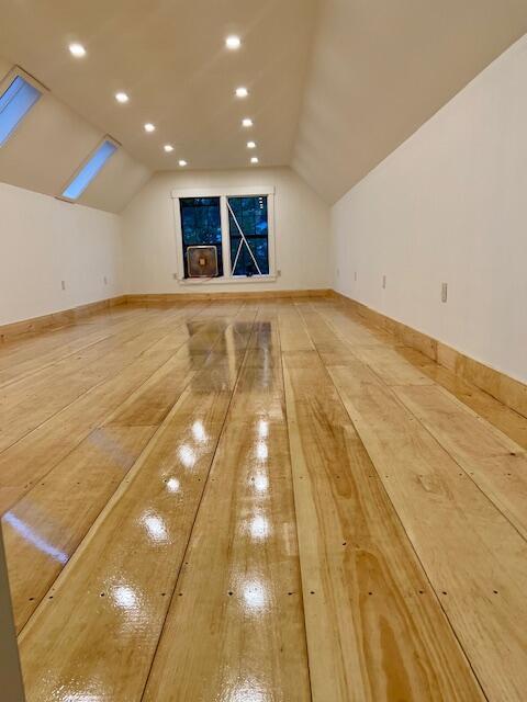 1 Forest St, Dover-Foxcroft, ME 04426 - bonus room with lofted ceiling, baseboards, and light wood-style flooring