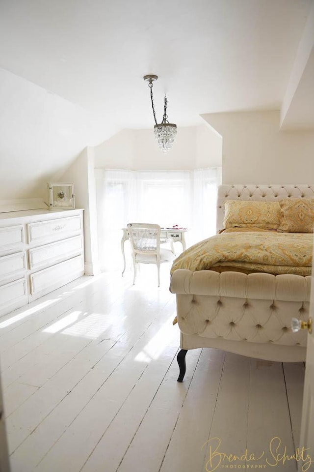 1 Forest St, Dover-Foxcroft, ME 04426 - bedroom with vaulted ceiling and wood finished floors