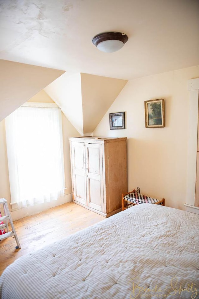 1 Forest St, Dover-Foxcroft, ME 04426 - unfurnished bedroom featuring wood finished floors and lofted ceiling