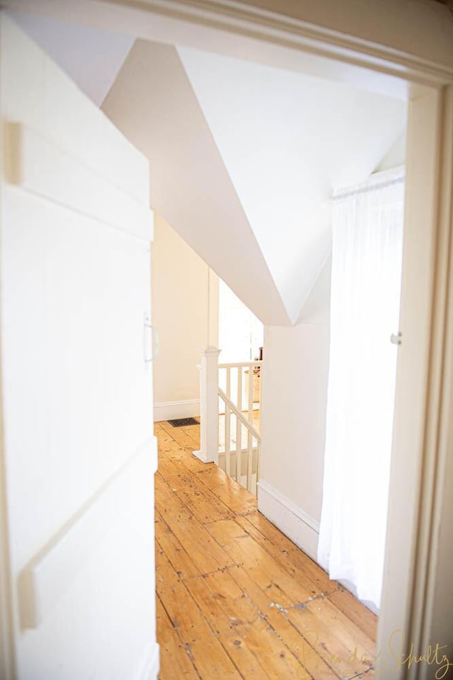 1 Forest St, Dover-Foxcroft, ME 04426 - hall featuring light wood finished floors, an upstairs landing, and vaulted ceiling