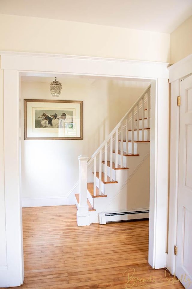 1 Forest St, Dover-Foxcroft, ME 04426 - stairway with a baseboard heating unit and wood finished floors