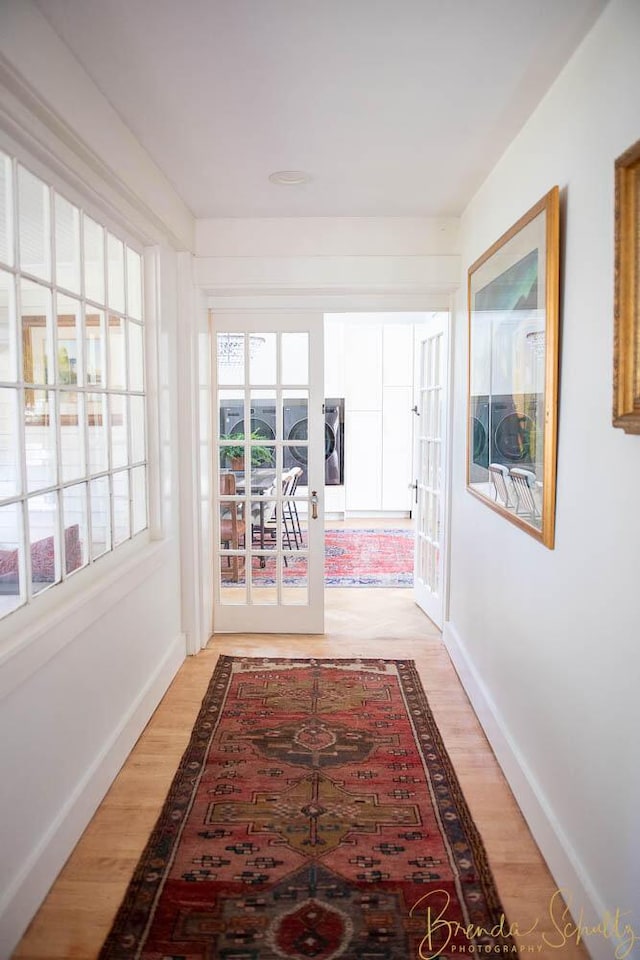 1 Forest St, Dover-Foxcroft, ME 04426 - hallway with light wood-style flooring and french doors