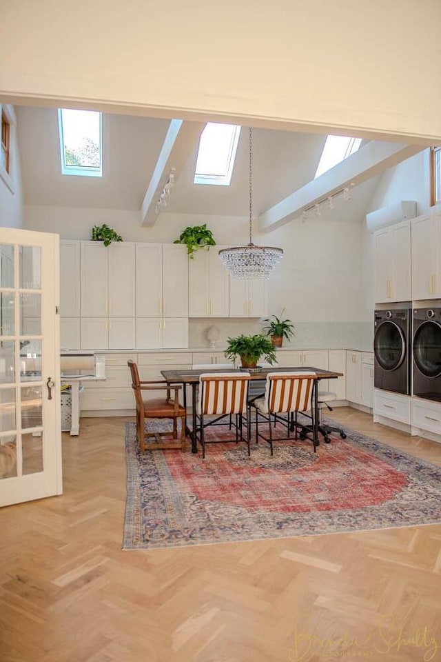 1 Forest St, Dover-Foxcroft, ME 04426 - dining room featuring a skylight, washer and clothes dryer, high vaulted ceiling, and plenty of natural light