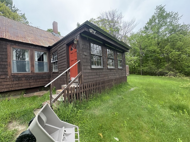 15 Sawyer Ln, Sanford, ME 04083 - doorway to property featuring a lawn and a chimney