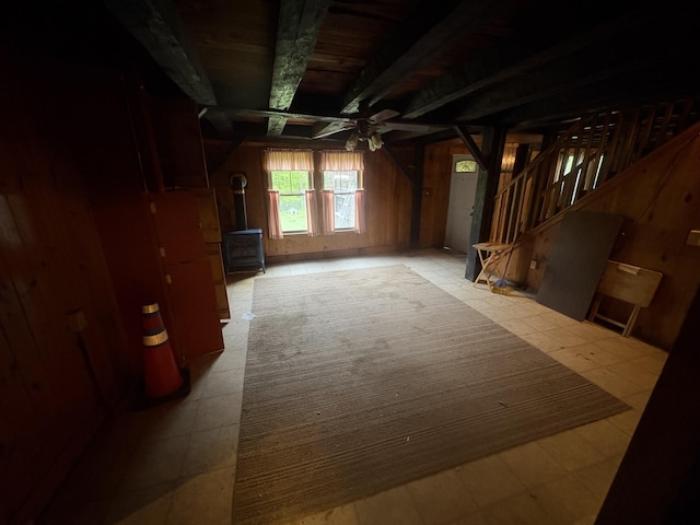 15 Sawyer Ln, Sanford, ME 04083 - interior space with a wood stove, tile patterned floors, ceiling fan, stairs, and wooden walls