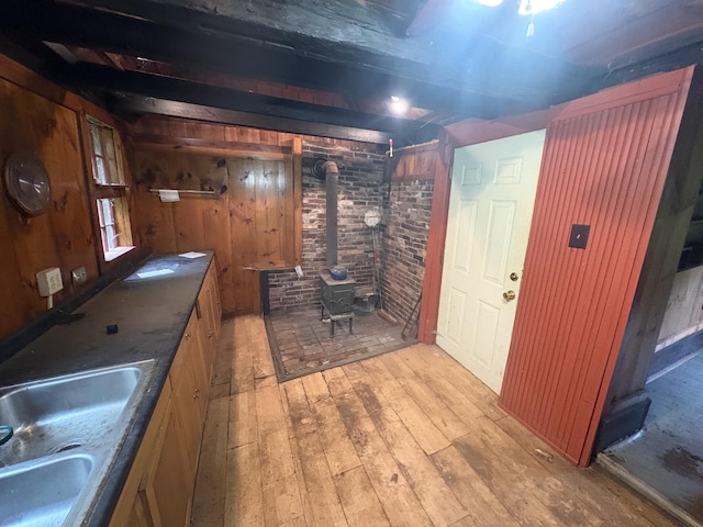 15 Sawyer Ln, Sanford, ME 04083 - bar area with a sink, light wood-style flooring, a wood stove, and wooden walls