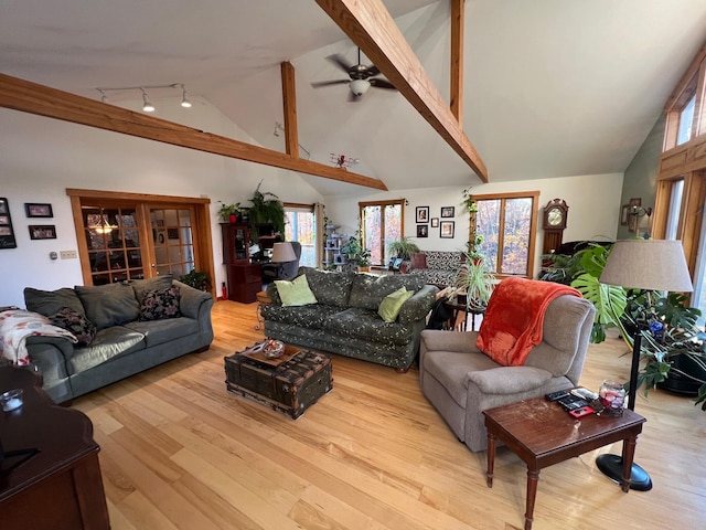 186 Clark Rd, Albion, ME 04910 - living room featuring wood finished floors, a ceiling fan, healthy amount of natural light, high vaulted ceiling, and beam ceiling