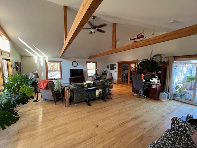 186 Clark Rd, Albion, ME 04910 - living room with wood finished floors, beam ceiling, a desk, a ceiling fan, and high vaulted ceiling