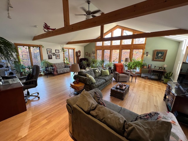 186 Clark Rd, Albion, ME 04910 - living area with beamed ceiling, light wood finished floors, ceiling fan, and high vaulted ceiling