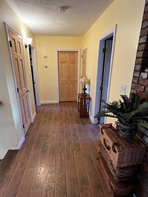 186 Clark Rd, Albion, ME 04910 - hallway with dark wood-style flooring and baseboards