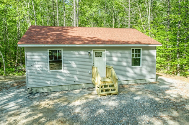 160 Maplewood Dr, Naples, ME 04055 - view of front of property featuring a wooded view and roof with shingles