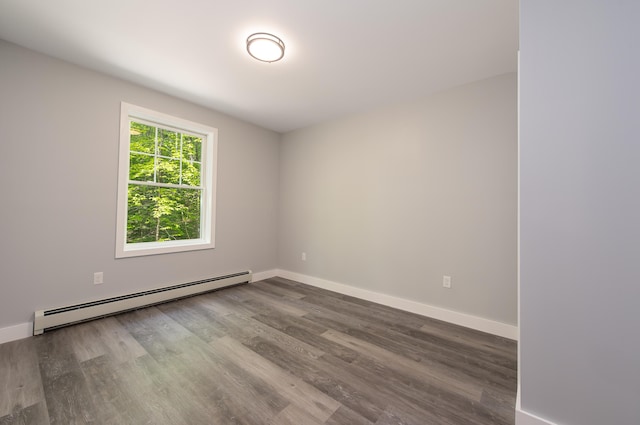 160 Maplewood Dr, Naples, ME 04055 - empty room with baseboard heating, wood finished floors, and baseboards