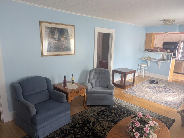 35 Brimmer St, Brewer, ME 04412 - living room with light wood-type flooring and ornamental molding