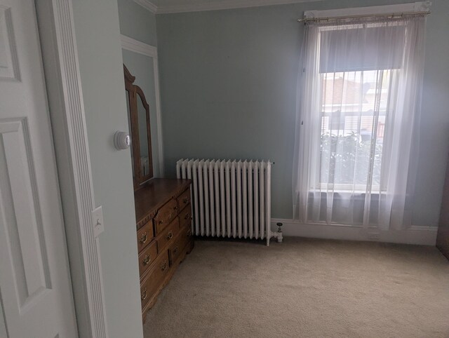 35 Brimmer St, Brewer, ME 04412 - bedroom featuring radiator, multiple windows, light carpet, and ornamental molding
