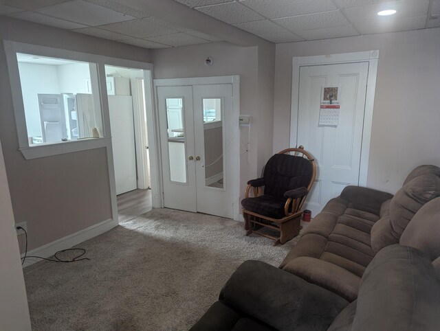 35 Brimmer St, Brewer, ME 04412 - living room with carpet, a drop ceiling, baseboards, and french doors