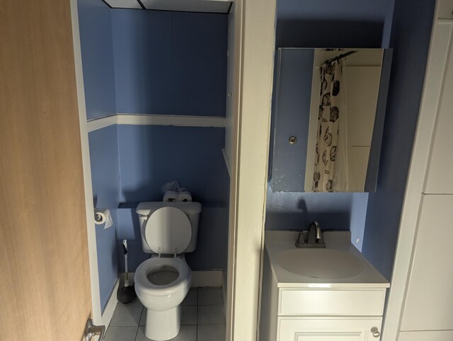 35 Brimmer St, Brewer, ME 04412 - bathroom featuring tile patterned flooring, vanity, toilet, a shower with shower curtain, and baseboards