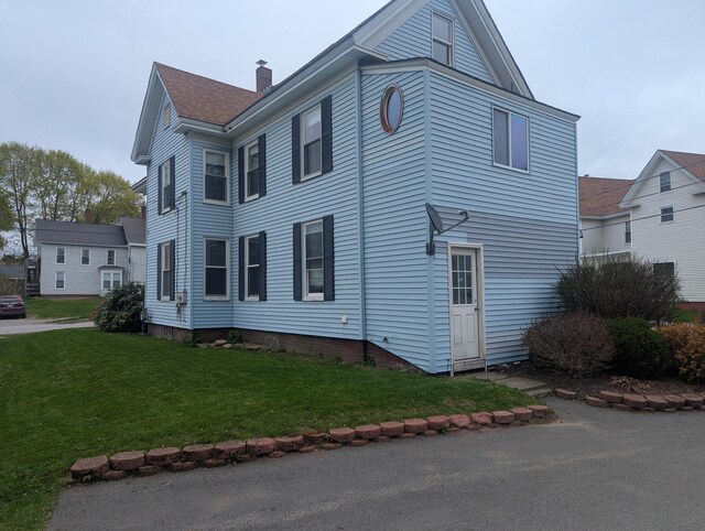35 Brimmer St, Brewer, ME 04412 - view of property exterior with a yard, a chimney, and a shingled roof