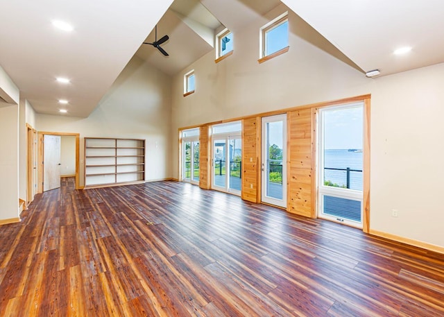 55 Diamond Point Rd, Lubec, ME 04652 - unfurnished living room featuring ceiling fan, wood finished floors, a towering ceiling, and recessed lighting