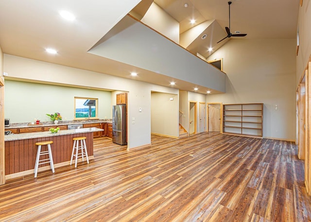 55 Diamond Point Rd, Lubec, ME 04652 - living room featuring stairs, light wood-style floors, recessed lighting, a high ceiling, and ceiling fan