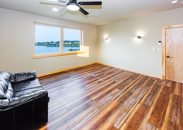 55 Diamond Point Rd, Lubec, ME 04652 - unfurnished living room with wood finished floors and a ceiling fan