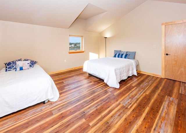 55 Diamond Point Rd, Lubec, ME 04652 - bedroom featuring wood finished floors and lofted ceiling