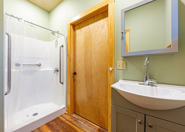 55 Diamond Point Rd, Lubec, ME 04652 - bathroom with a shower with curtain, wood finished floors, and vanity