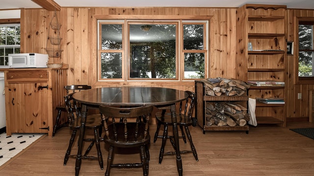 369 Narrow Gauge Trl, Hiram, ME 04041 - dining area with wood walls and light wood finished floors