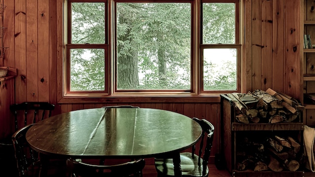 369 Narrow Gauge Trl, Hiram, ME 04041 - dining room with wood walls and healthy amount of natural light