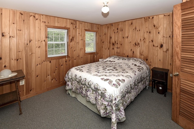 369 Narrow Gauge Trl, Hiram, ME 04041 - carpeted bedroom with wood walls and baseboards
