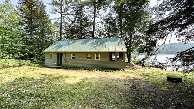 369 Narrow Gauge Trl, Hiram, ME 04041 - view of front of home featuring a metal roof and a front yard