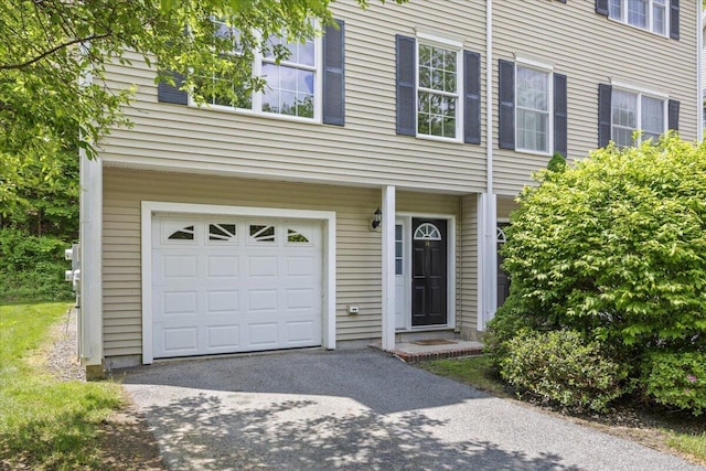 14 Woodside Dr Unit 3, Gorham, ME 04038 - view of property featuring a garage and asphalt driveway