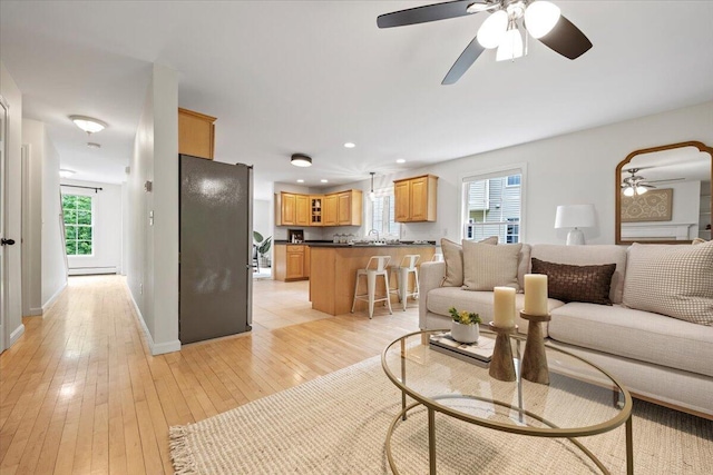 14 Woodside Dr Unit 3, Gorham, ME 04038 - living room with a ceiling fan, light wood-style floors, healthy amount of natural light, recessed lighting, and baseboards