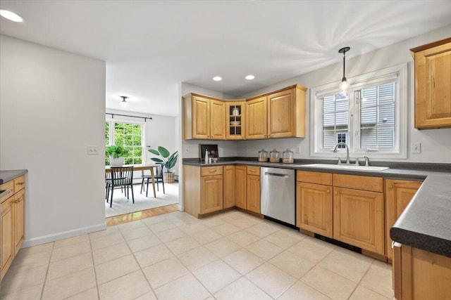 14 Woodside Dr Unit 3, Gorham, ME 04038 - kitchen featuring stainless steel dishwasher, a sink, dark countertops, hanging light fixtures, and glass insert cabinets