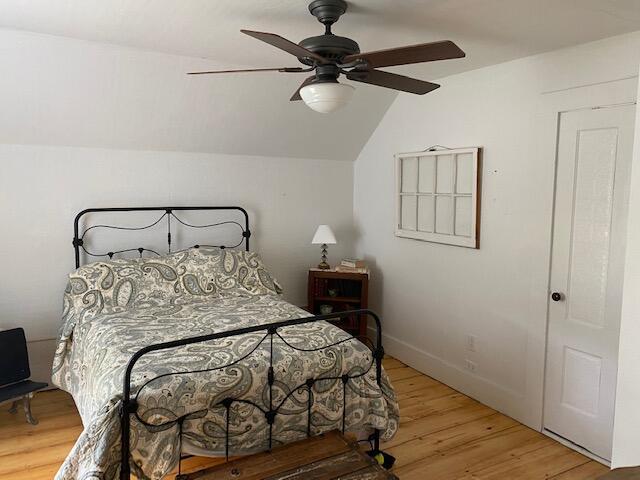 58 Main St, Sangerville, ME 04479 - bedroom with wood finished floors, lofted ceiling, ceiling fan, and baseboards