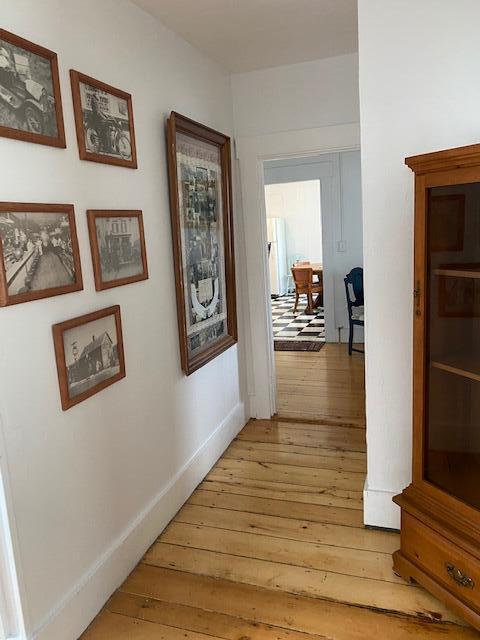 58 Main St, Sangerville, ME 04479 - hallway with light wood-style flooring and baseboards