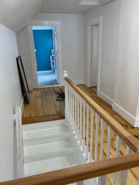 58 Main St, Sangerville, ME 04479 - staircase featuring vaulted ceiling