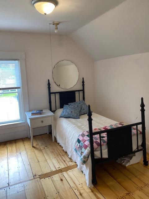 58 Main St, Sangerville, ME 04479 - bedroom featuring hardwood / wood-style flooring and lofted ceiling