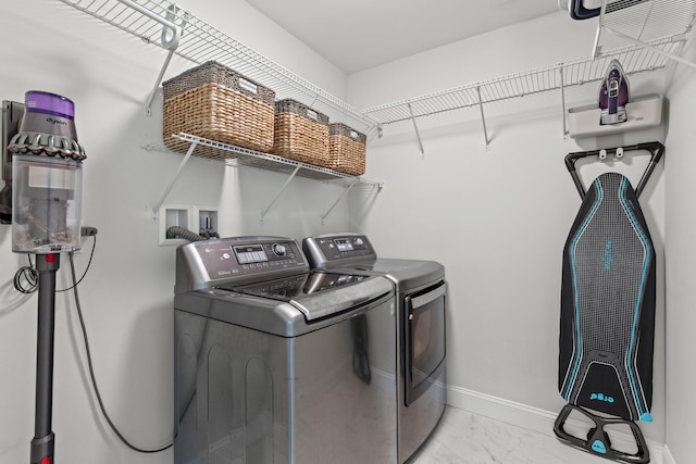 66 Old Dynamite Way, Gorham, ME 04038 - laundry room with washer and dryer, light marble finish floors, and baseboards