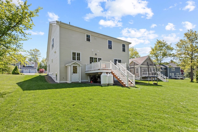 66 Old Dynamite Way, Gorham, ME 04038 - rear view of property with stairs, a deck, a sunroom, and a yard