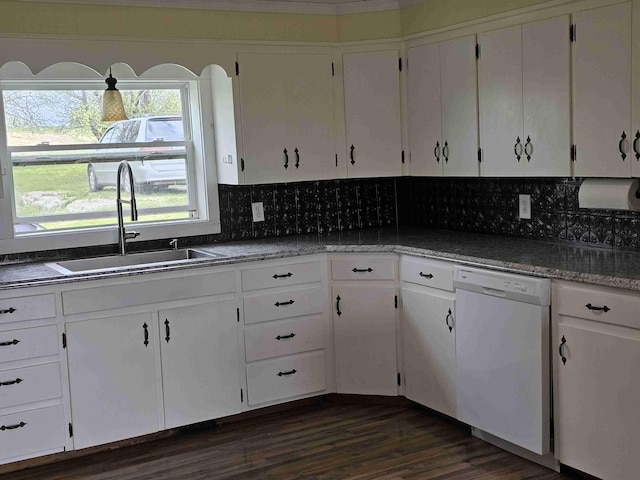 393 Main St, Limestone, ME 04750 - kitchen with white dishwasher, a sink, white cabinetry, decorative backsplash, and dark wood-style flooring