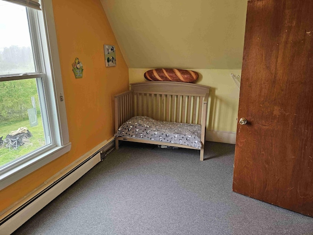 393 Main St, Limestone, ME 04750 - bedroom with a baseboard radiator, lofted ceiling, and carpet flooring